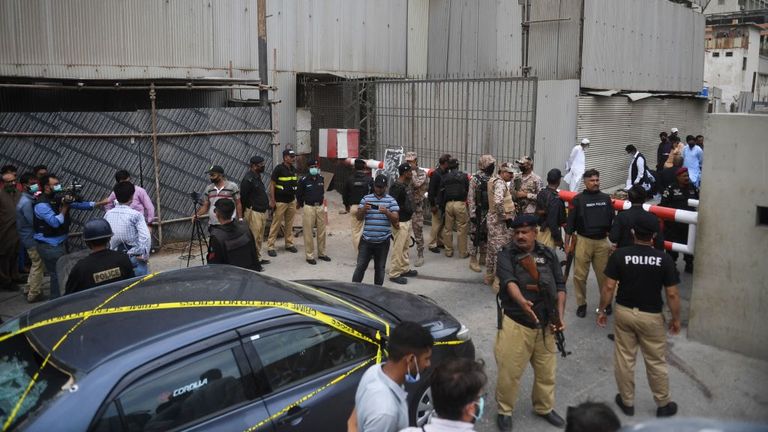 Officers are seen gathered outside of the stock exchange building on Monday morning