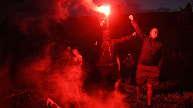 Liverpool fans celebrate outside Anfield