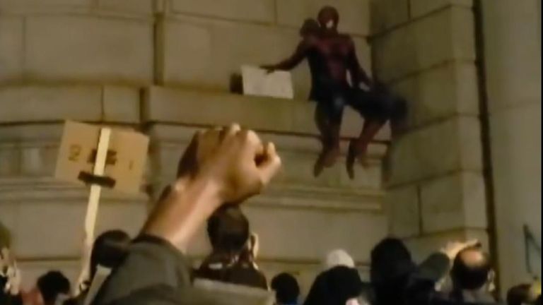 A figure in a Spider-Man costume was seen scaling part of the Manhattan Bridge during protest marches in New York on June 2.