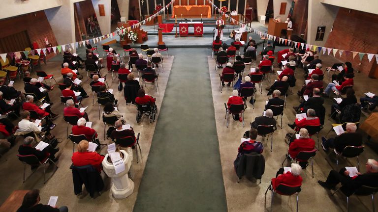 Parishioners socially distance inside a church in Whangarei, New Zealand