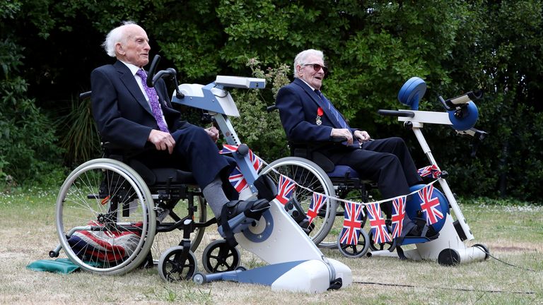 Normandy Veterans Peter Hawkins (left) and Len Gibbon finish their 104-mile cycling challenge,