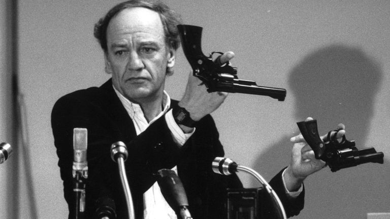 Hans Holmér, former head of the investigation of the assassination of Swedish Prime Minister Olof Palme, shows two Smith & Wesson 357 Magnum revolvers during a press conference in Stockholm, on March 31, 1986