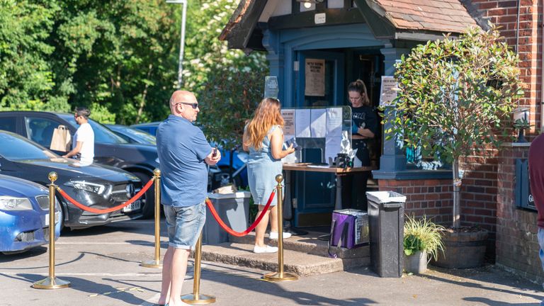 Customers may have to queue before entering a pub