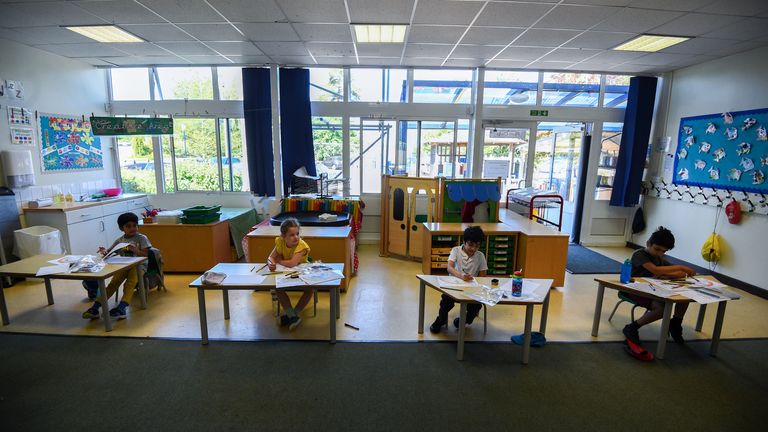 Pupils sit at separate desks at Hiltingbury Infant School in Hampshire 