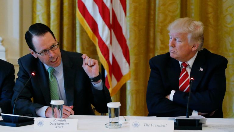 AT&T&#39;s Randall Stephenson (L) speaks as U.S. President Donald Trump meets with technology and telecommunications executives at the White House in Washington, U.S., June 20, 2017