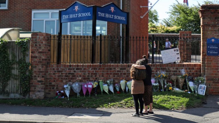 Flowers placed at the entrance to the Holt School, Wokingham, Berskhire, in memory of teacher James Furlong, a victim of the terrorist attack in Forbury Gardens, Reading, on Saturday in which three people died. PA Photo. Picture date: Monday June 22, 2020. A terror suspect remains in custody accused of killing three people in a Reading park on Saturday night and wounding three others. The 25-year-old man, understood to be named Khairi Saadallah, was detained a short distance from the scene and arrested on suspicion of murder. See PA story POLICE Reading. Photo credit should read: Steve Parsons/PA Wire