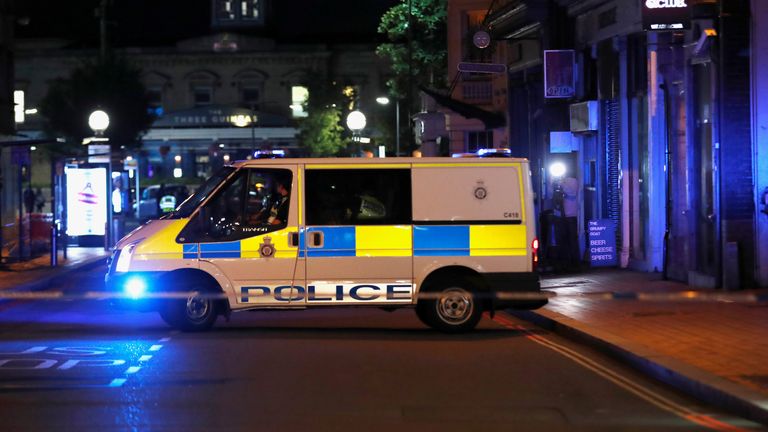 A police van is seen with cordon tape at the scene of reported multiple stabbings in Reading, Britain, June 20, 2020. REUTERS/Peter Cziborra