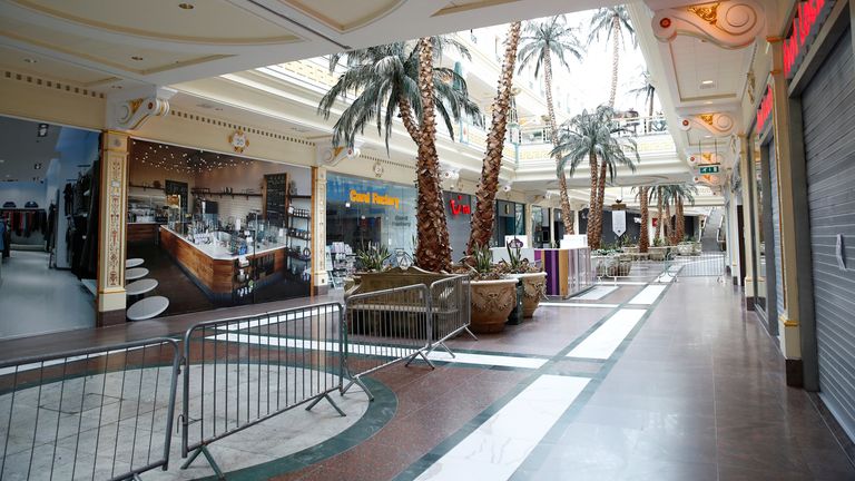 Barriers and shops are seen inside the Trafford Centre in Manchester