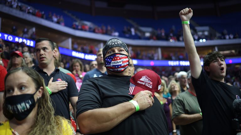 Supporters participate in the Pledge of Allegiance during a campaign rally for U.S. President Donald Trump at the BOK Center, June 20, 2020 in Tulsa, Oklahoma