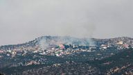 A picture taken from the Israeli side of the Blue Line that separates Israel and Lebanon shows smoke billowing above the Shebaa village sector in southern Lebanon, after reports of clashes in the border area, on July 27, 2020. (Photo by Jalaa MAREY / AFP) (Photo by JALAA MAREY/AFP via Getty Images)