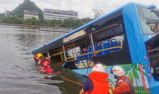 China: Twenty-one dead and 15 injured after bus crashes into lake