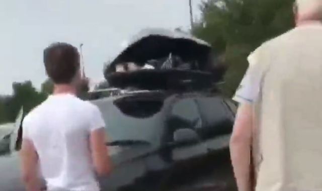 British family find migrants hiding in car luggage box during holiday to France