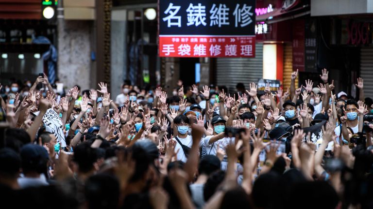 TOPSHOT - Protesters chant slogans and gesture during a rally against a new national security law in Hong Kong on July 1, 2020, on the 23rd anniversary of the city's handover from Britain to China. - Hong Kong police arrested more than 300 people on July 1 -- including nine under China's new national security law -- as thousands defied a ban on protests on the anniversary of the city's handover to China. (Photo by Anthony WALLACE / AFP) (Photo by ANTHONY WALLACE/AFP via Getty Images)