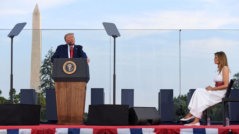 US President Donald Trump speaks as First Lady Melania Trump listens during the 2020 "Salute to America" event in honor of Independence Day on the South Lawn of the White House in Washington, DC, July 4, 2020. (Photo by SAUL LOEB / AFP) (Photo by SAUL LOEB/AFP via Getty Images)