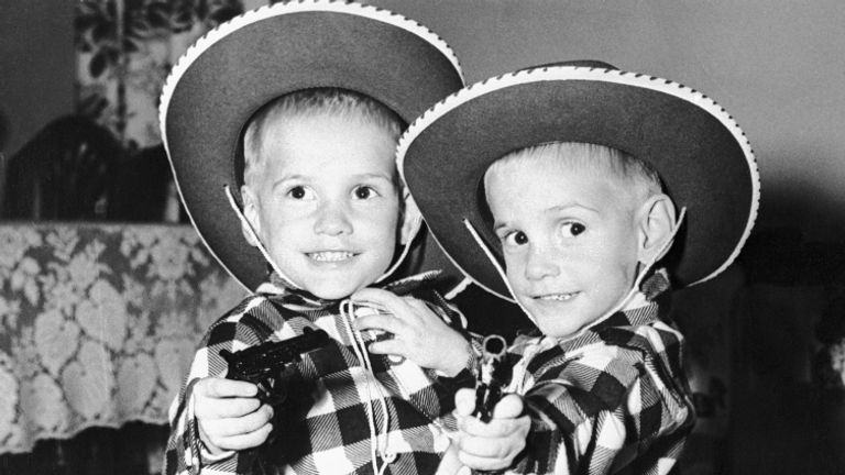 (Original Caption) Siamese twins Ronnie and Donnie Galyon pose in their cowboy suits on their third birthday in Dayton. The children are joined at the waist. Doctors say surgery to separate them would mean death for one. Parents of the twins, Mr. and Mrs.. Wesley Galyon said "we'll never separate them. We don't even talk about it anymore." In walking, the boys take turns going backwards.