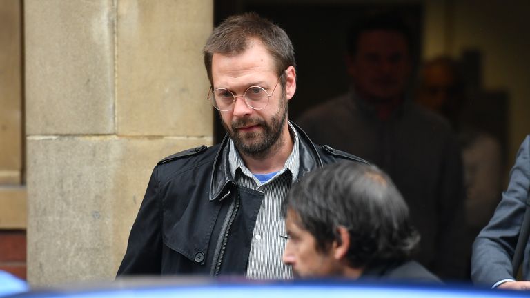 Ex-Kasabian singer Tom Meighan leaving Leicester Magistrates' Court where he was sentenced to carry out 200 hours of unpaid work for assaulting former fiancee Vikki Ager.