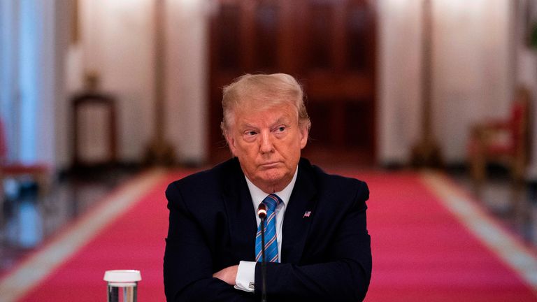 US President Donald Trump sits with his arms crossed during a roundtable discussion on the Safe Reopening of Americas Schools during the coronavirus pandemic, in the East Room of the White House on July 7, 2020, in Washington, DC. (Photo by JIM WATSON / AFP) (Photo by JIM WATSON/AFP via Getty Images)