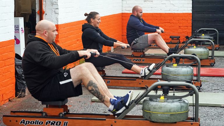 People take part in a small exercise class at the Lionheart Fitness gym in Bedlington, Northumberland, which has moved some equipment into the car park as indoor gyms are still not permitted to open due to coronavirus lockdown restrictions.