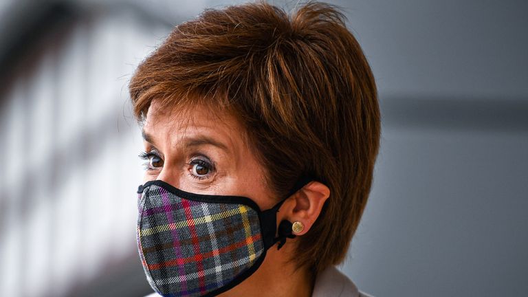 First Minister Nicola Sturgeon, wearing a Tartan face mask during a visit to New Look at Ford Kinaird Retail Park in Edinburgh.