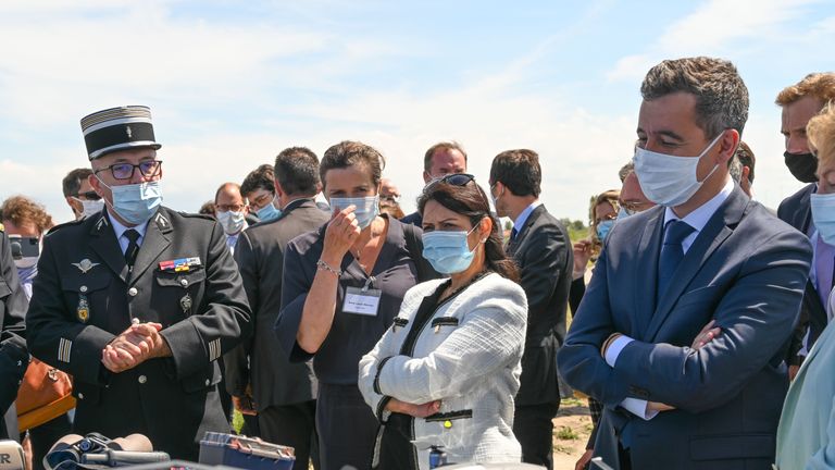 Britain's Home Secretary Priti Patel (C) and French Interior Minister Gerald Darmanin (R), wearing face masks, look at French police equipment during their visit in Calais on July 12, 2020. (Photo by DENIS CHARLET / AFP) (Photo by DENIS CHARLET/AFP via Getty Images)