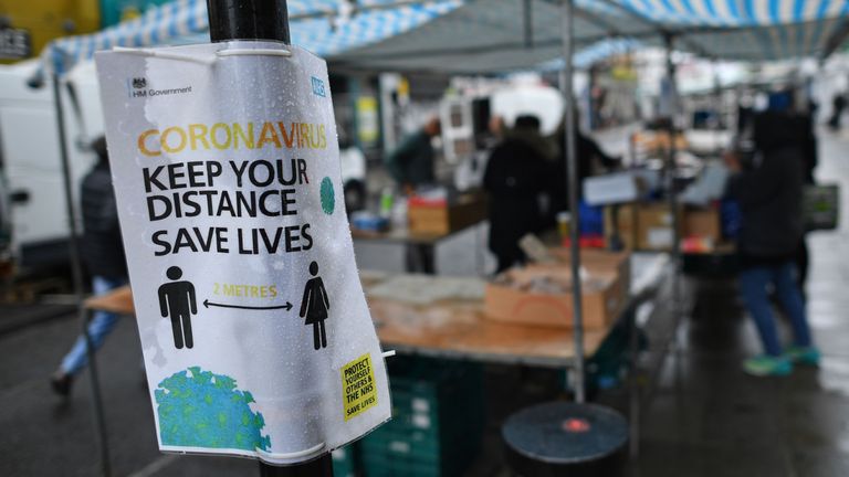 A sign promotes social distancing at Portobello Road Market in London on June 6, 2020, as lockdown measures are partially eased during the novel coronavirus COVID-19 pandemic. - Outdoor markets swung open their gates on June 1, and car showrooms tried to lure back customers and recoup losses suffered since Britain effectively shut down for business on March 23, to ward off a disease that has now officially claimed more than 40,000 lives in the country. Britain&#39;s Health Ministry said 40,261 people who tested positive for COVID-19 had died as of 0800 GMT on Friday June 5. (Photo by Ben STANSALL / AFP) (Photo by BEN STANSALL/AFP via Getty Images)