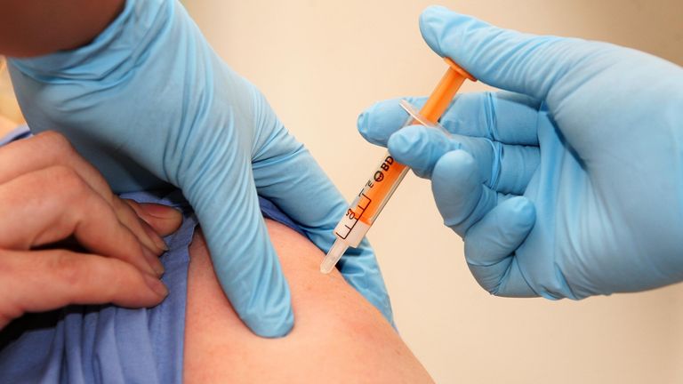 LONDON - OCTOBER 21: A patient is given a swine flu vaccination at the University College London Hospital as the mass immunisation programme begins today on October 21, 2009 in London, England.  The programme, offering more than 11 million people the vaccine, began with hospitals immunising frontline healthcare workers and their patients who fall into at-risk categories. (Photo by Lewis Whyld- WPA Pool/Getty Images)