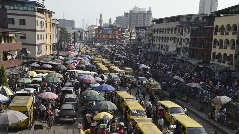 Roadside vendors take over Idumota road to sell their wares ahead of Chritsmas festival in Lagos, on December 16, 2019. - As Christmas festival and holidays draws near, Lagos metroplis, Nigeria's commercial capital is a behive of activites and almost at its peak as people shop for gift items for relatives, friends and loved ones, despite the prevailing traffic gridlock, erractic power supply, and the most intense heat wave ever in its history associated with climate change. (Photo by PIUS UTOMI EKPEI / AFP) (Photo by PIUS UTOMI EKPEI/AFP via Getty Images)
