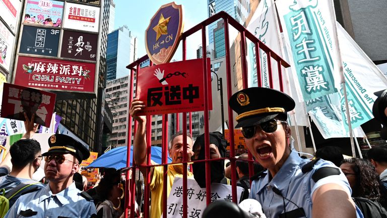TOPSHOT - Activists attend a protest in Hong Kong on April 28, 2019, against a controversial move by the government to allow extraditions to the Chinese mainland. - Hong Kong's government has recently announced plans to overhaul its extradition rules, allowing the transfer of fugitives with Taiwan, Macau and mainland China on a "case-basis" for the first time. (Photo by Anthony WALLACE / AFP)        (Photo credit should read ANTHONY WALLACE/AFP via Getty Images)