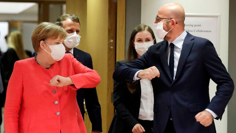 Germany's Chancellor Angela Merkel (L) and President of the European Council Charles Michel greets prior the start of the European Union Council in Brussels on July 17, 2020, as the leaders of the European Union hold their first face-to-face summit over a post-virus economic rescue plan. - The EU has been plunged into a historic economic crunch by the coronavirus crisis, and EU officials have drawn up plans for a huge stimulus package to lead their countries out of lockdown. (Photo by STEPHANIE LECOCQ / POOL / AFP) (Photo by STEPHANIE LECOCQ/POOL/AFP via Getty Images)