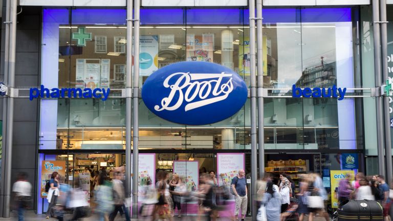 LONDON, ENGLAND - AUGUST 06:  Members of the public walk past a branch of Boots the chemist on Oxford Street on August 6, 2014 in London, England. US pharmacy chain 'Walgreens', who previously owned 45% of 'Alliance Boots' has announced a 9 billion GBP purchase of the remaining shares in the company. Boots currently have 2,487 stores across the UK and employ over 60,000 people.  (Photo by Oli Scarff/Getty Images)