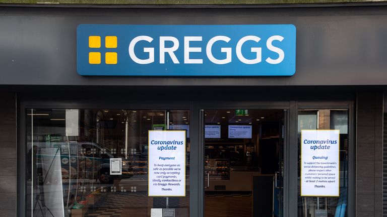 CARDIFF, UNITED KINGDOM - MARCH 23: Signs in the window of a Greggs store with queueing and payment policies on March 23, 2020 in Cardiff, United Kingdom. Coronavirus (COVID-19) pandemic has spread to at least 182 countries, claiming over 10,000 lives and infecting hundreds of thousands more. (Photo by Polly Thomas/Getty Images)