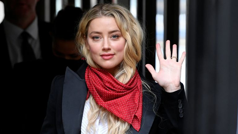 Actor Amber Heard waves as she arrives at the High Court in London, Britain July 14, 2020. REUTERS/Toby Melville