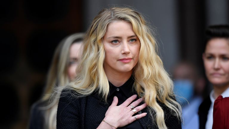 Actor Amber Heard delivers a statement as she leaves the High Court