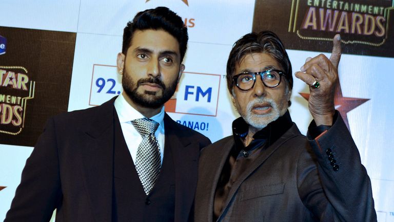Amitabh&#39;s son Abhishek Bachchan (L) has also tested positive for COVID-19