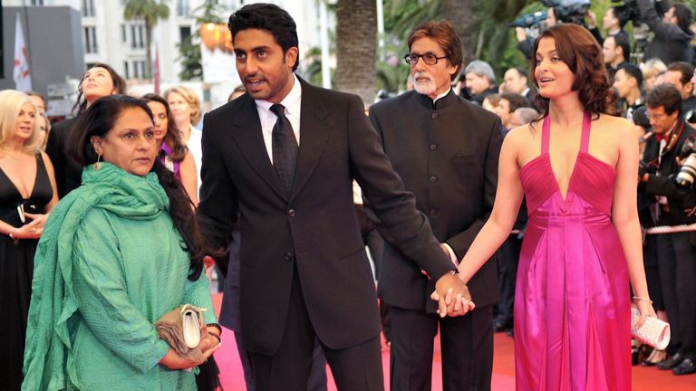 Bollwood star Amitabh Bachchan, 77, (3rd R) and his son (2nd R) are in hospital with COVID-19