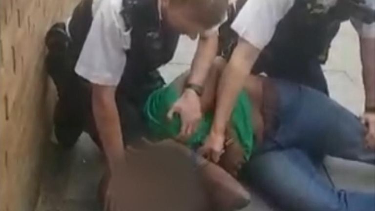 Video has emerged showing a man being detained by two police officers in Islington, with one placing his knee on the man&#39;s neck