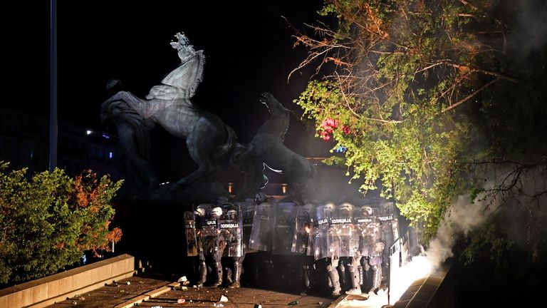 Demonstrators clash with riot police during an anti-government protest on July 10, 2020 in Belgrade, Serbia.