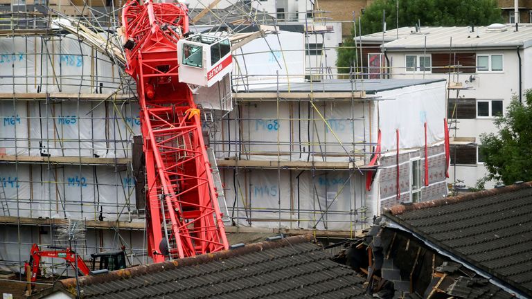 A collapsed crane is seen near a construction site in Bow, east London, Britain, July 8, 2020. REUTERS/Hannah McKay