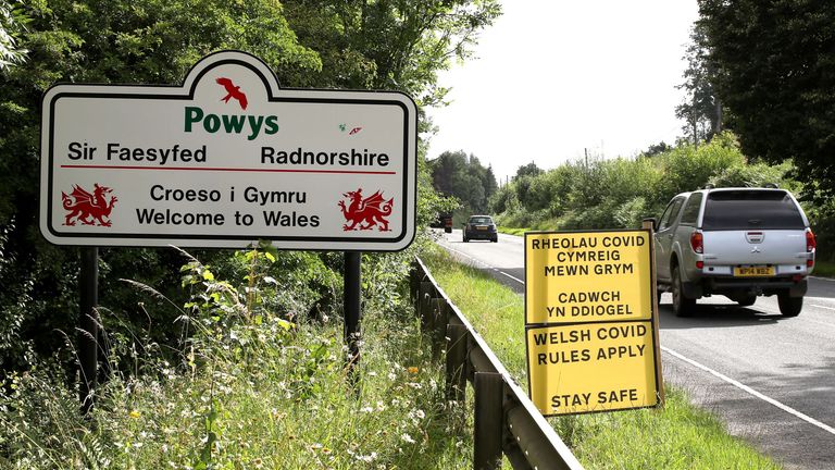 A car drives past the Wales border line between Wales and England following the easing of coronavirus lockdown restrictions across England.
