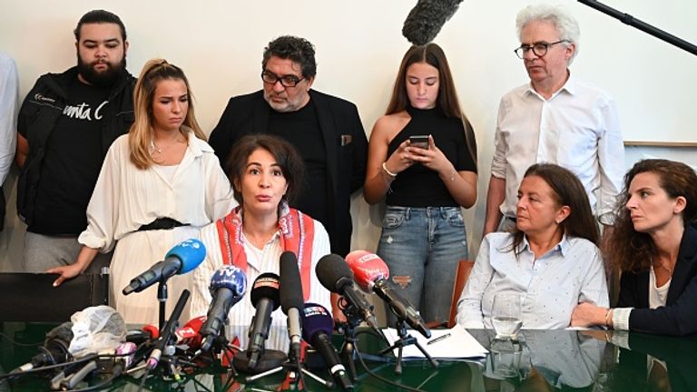His widow (centre) at a press conference in Paris last month