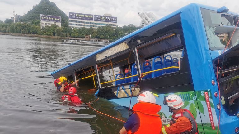 The bus turned 90 degrees on a six-lane dual carriageway before crashing through a barrier into the lake, state media said