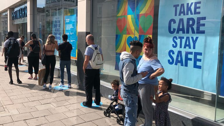BRIGHTON, UNITED KINGDOM - JUNE 15: (EDITOR&#39;S NOTE: Image taken with a iPhone 8) Shoppers queue for the Primark store on June 15, 2020 in Brighton, United Kingdom. The British government have relaxed coronavirus lockdown laws significantly from Monday June 15, allowing zoos, safari parks and non-essential shops to open to visitors. Places of worship will allow individual prayers and protective facemasks become mandatory on London Transport. (Photo by Mike Hewitt/Getty Images)