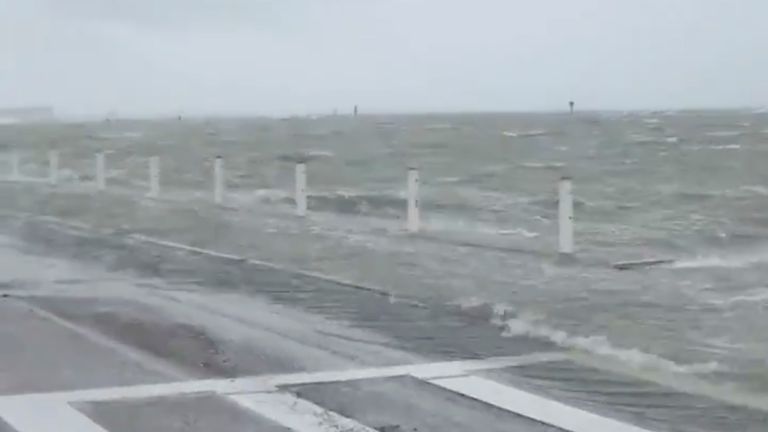 A storm surge swells in Corpus Christi Bay as Hurricane Hanna approaches