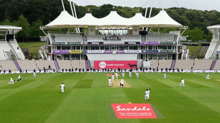 SOUTHAMPTON, ENGLAND - JULY 08: England and West Indies players take a knee ahead of day one of the 1st #RaiseTheBat Test match at The Ageas Bowl on July 08, 2020 in Southampton, England. (Photo by Stu Forster/Getty Images for ECB)
