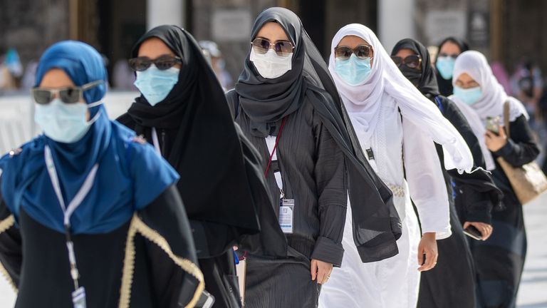 Pilgrims wear masks at the centre of the Grand Mosque in the holy city of Mecca
