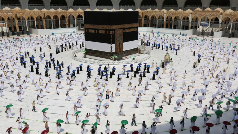Socially-distanced pilgrims walk around the Kaaba at the centre of the Grand Mosque in Mecca