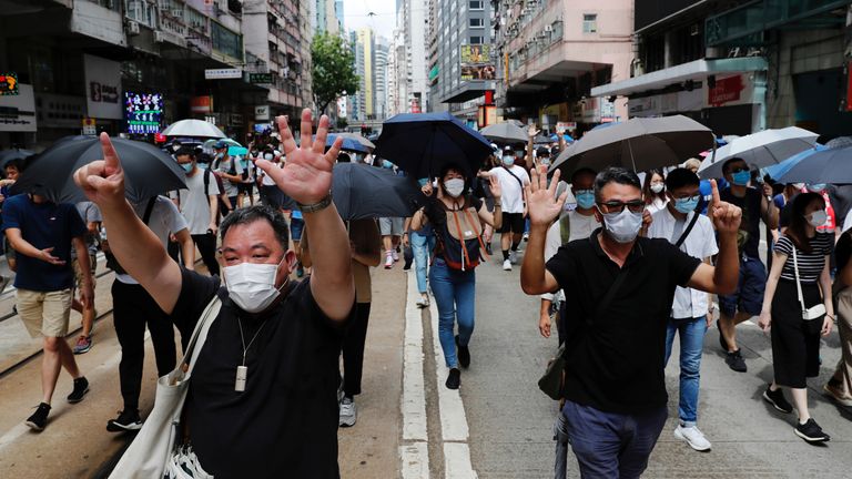 Anti-national security law protesters march at the anniversary of Hong Kong's handover to China from Britain in Hong Kong, China July 1, 2020. REUTERS/Tyrone Siu