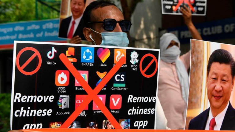 Members of the Working Journalist of India (WJI) hold placards urging citizens to remove Chinese apps and stop using Chinese products during a demonstration against the Chinese newspaper Global Times, in New Delhi on June 30, 2020.