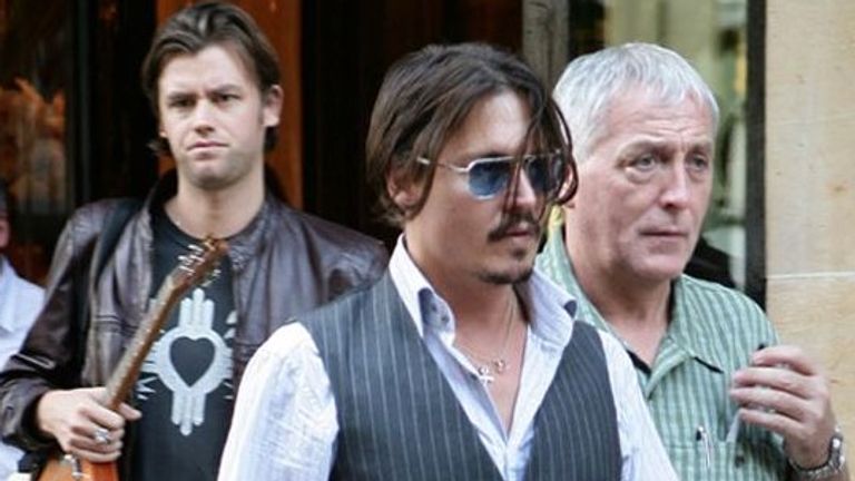Johnny Depp pictured with then assistant Stephen Deuters (left) and late security guard Jerry Judge