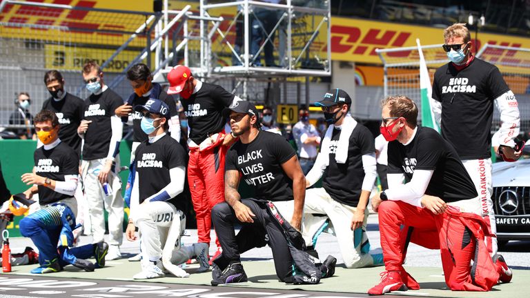 Lewis Hamilton is joined by other F1 drivers in taking a knee on the grid